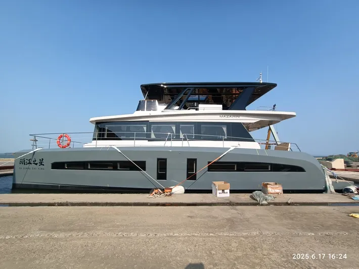  Yacht Photos Pics 2025 Mazarin 55 Catamaran Hybrid Electric EVO II docked at marina.