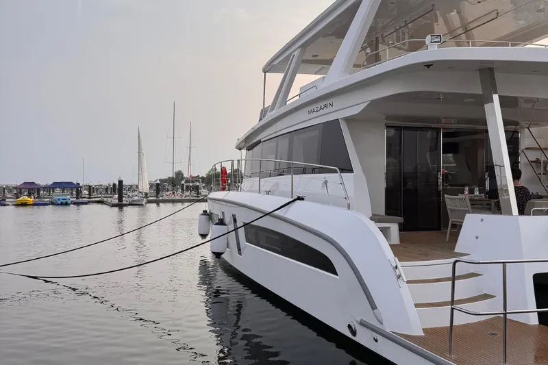  Yacht Photos Pics 2025 Mazarin 55 Catamaran Hybrid Electric EVO II docked at marina.
