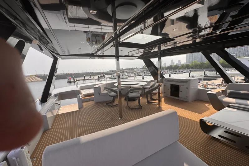  Yacht Photos Pics Luxurious 2025 Mazarin 55 Catamaran with hybrid electric technology, featuring spacious deck and modern seating.