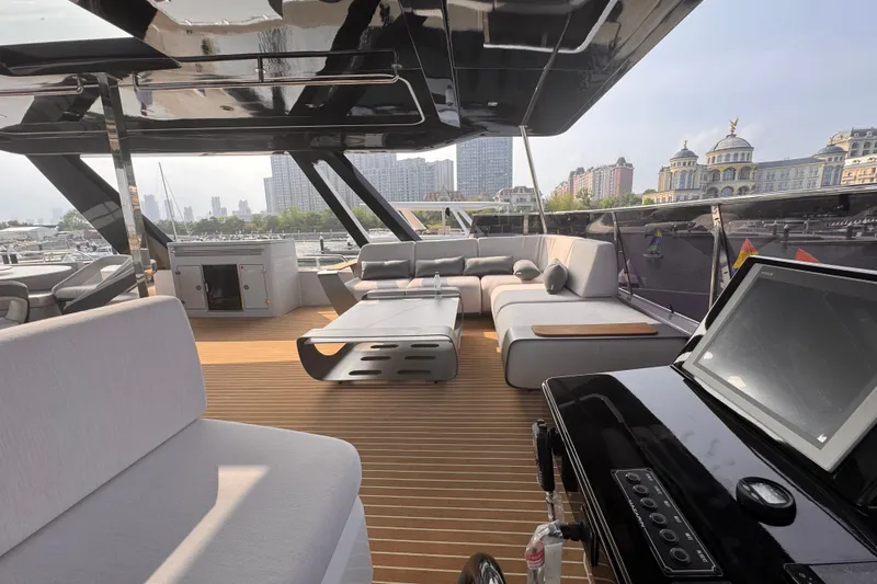  Yacht Photos Pics Luxurious 2025 Mazarin 55 Catamaran interior with modern seating and cityscape view.