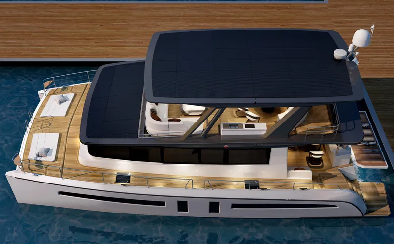  Yacht Photos Pics 2025 Mazarin 55 Catamaran Hybrid Electric EVO II docked, showcasing sleek design and spacious deck.