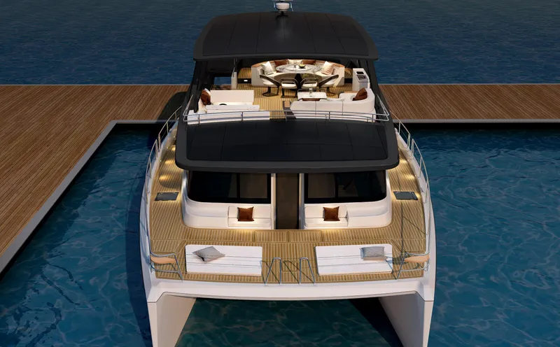  Yacht Photos Pics 2025 Mazarin 55 Catamaran Hybrid Electric EVO II docked, showcasing luxurious deck and seating.