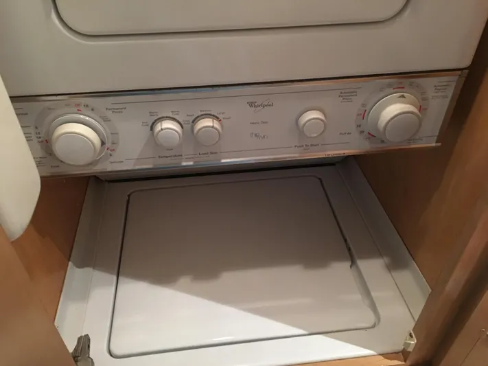 Tropic Jones Yacht Photos Pics Stacked washer and dryer unit in 1997 Hatteras 52 Cockpit Motor Yacht.