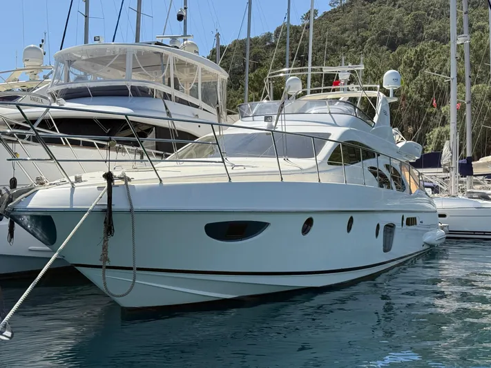 Nvn Yacht Photos Pics 2007 Azimut 62 yacht docked in a marina, surrounded by other boats.