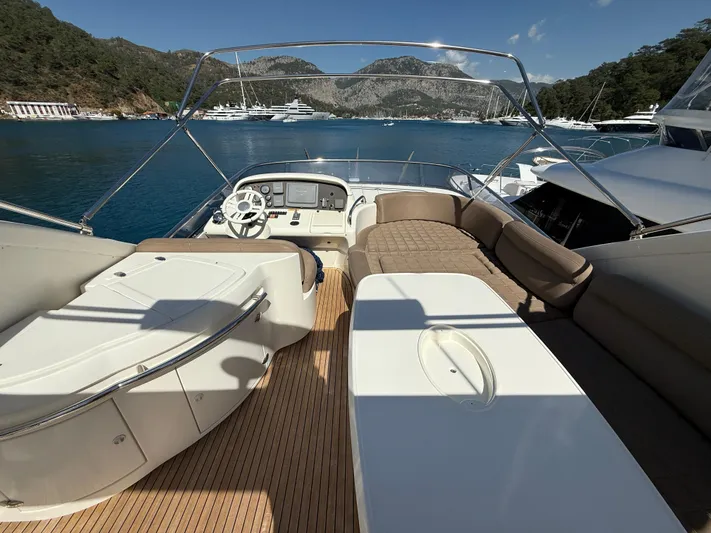Nvn Yacht Photos Pics Flybridge of 2007 Azimut 62 yacht with seating, table, and scenic ocean view.