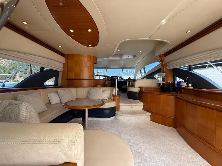 Nvn Yacht Photos Pics Luxurious interior of a 2007 Azimut 62 yacht with elegant wood and plush seating.