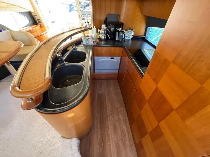 Nvn Yacht Photos Pics Luxurious kitchen interior of a 2007 Azimut 62 yacht with modern amenities.