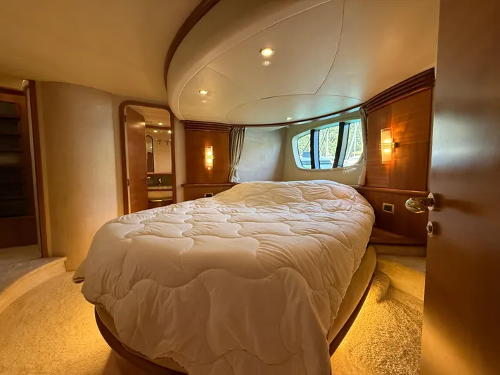 Nvn Yacht Photos Pics Luxurious bedroom interior of 2007 Azimut 62 yacht with cozy bed and elegant lighting.