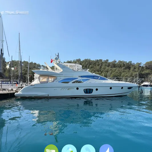 Nvn Yacht Photos Pics 2007 Azimut 62 yacht docked in a serene marina setting.