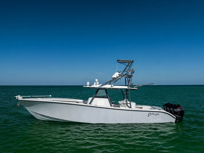  Yacht Photos Pics 2023 Yellowfin 39 Offshore boat on calm ocean under clear blue sky.