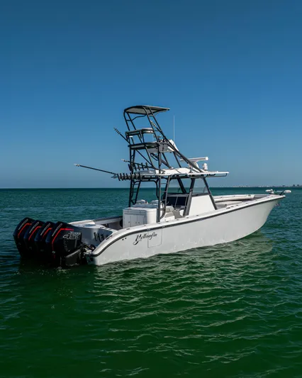  Yacht Photos Pics 2023 Yellowfin 39 Offshore boat on clear blue water under a sunny sky.
