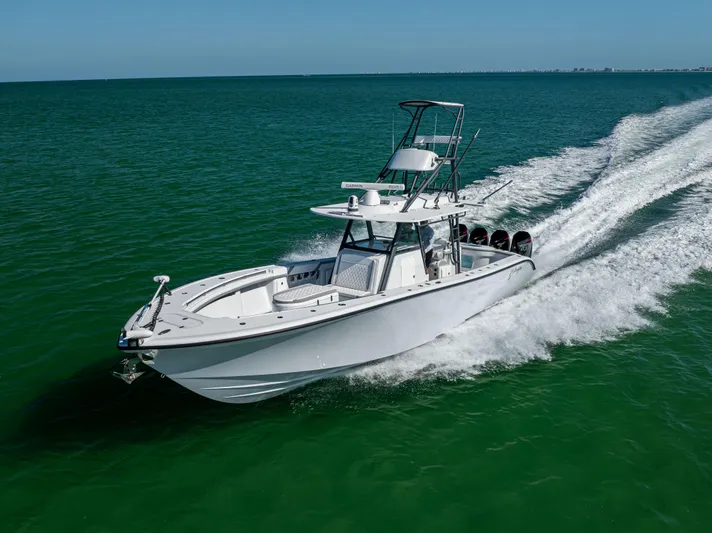  Yacht Photos Pics 2023 Yellowfin 39 Offshore boat cruising on open water, showcasing sleek design and powerful performance.