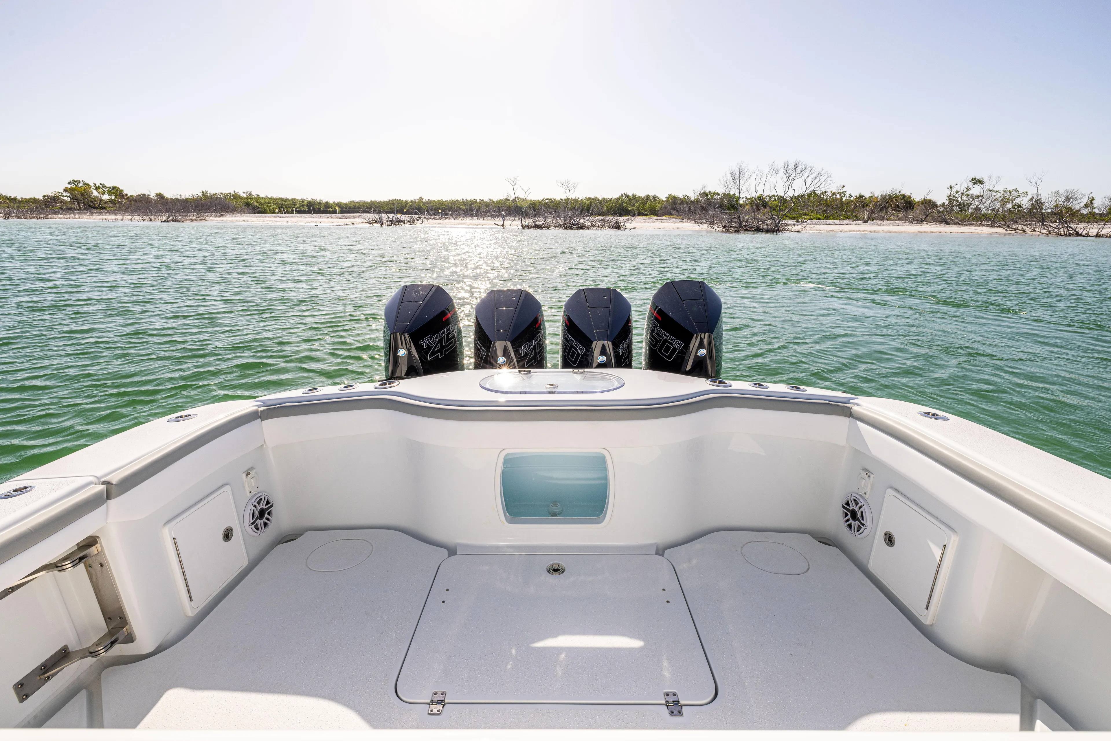  Yacht Photos Pics 2023 Yellowfin 39 Offshore boat with four engines on calm water.