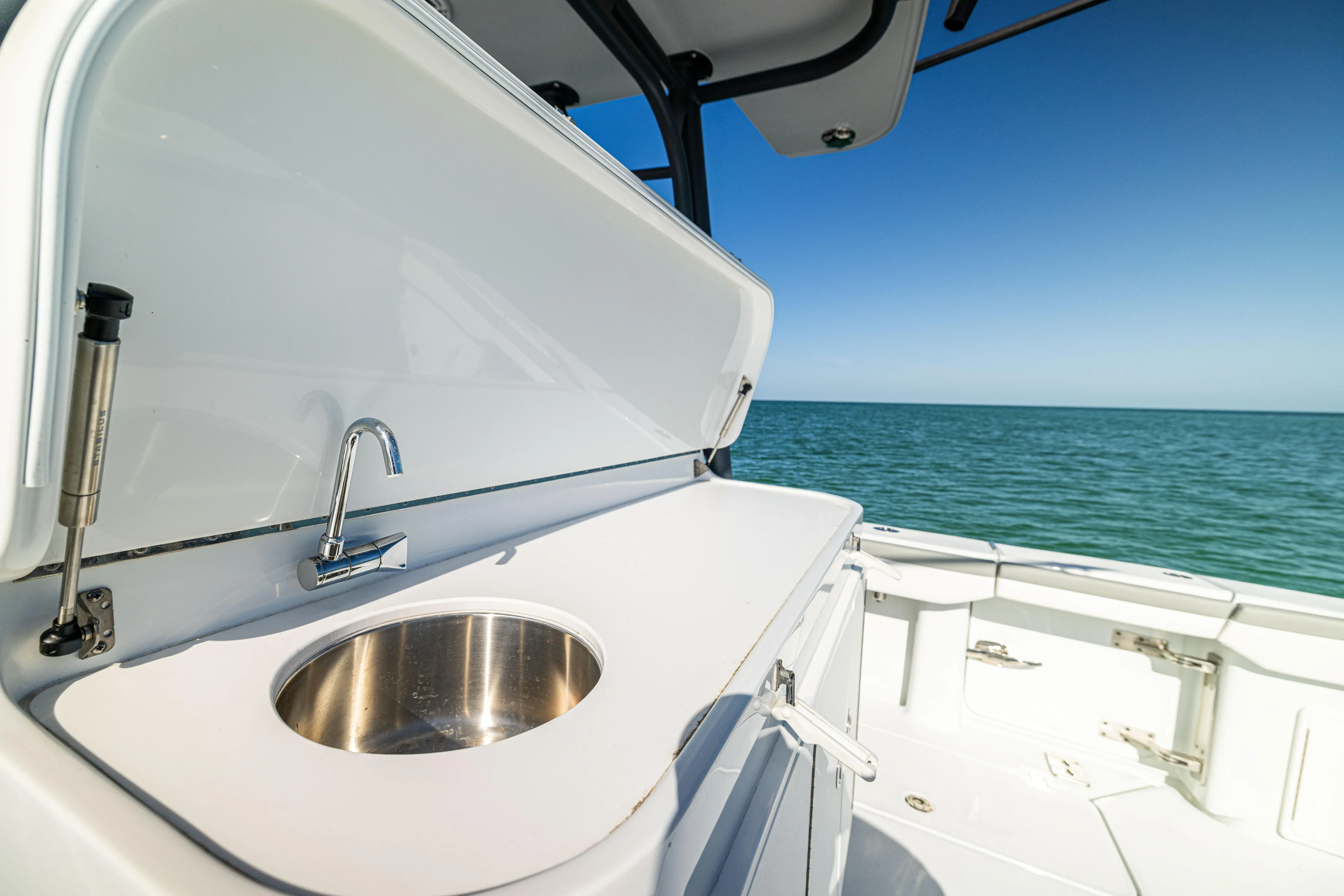  Yacht Photos Pics 2023 Yellowfin 39 Offshore boat with sink, ocean view, and clear blue sky.