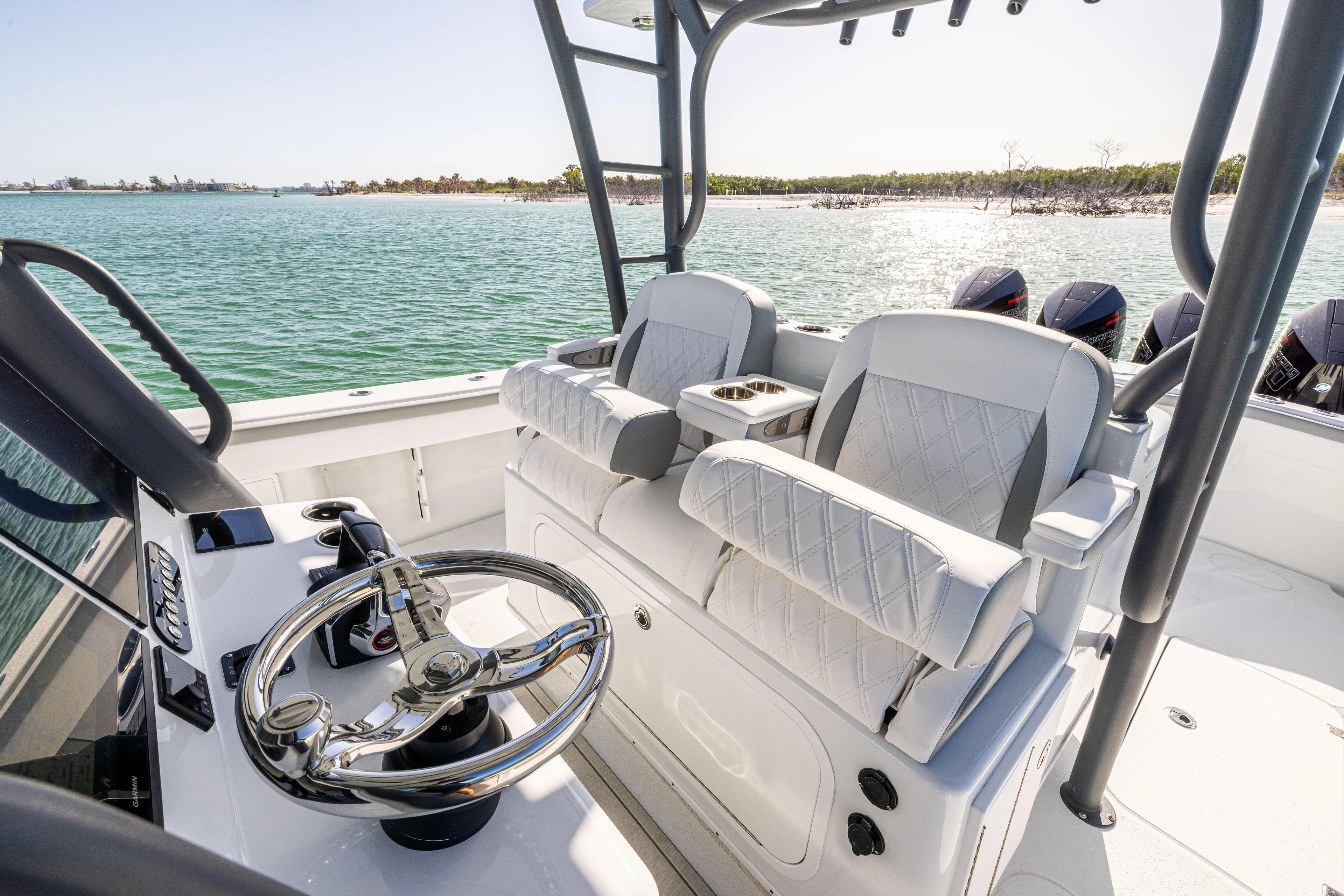  Yacht Photos Pics 2023 Yellowfin 39 Offshore boat interior with dual seats and steering wheel, overlooking the ocean.