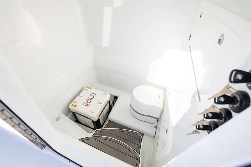  Yacht Photos Pics 2023 Yellowfin 39 Offshore boat interior with toilet and storage area.