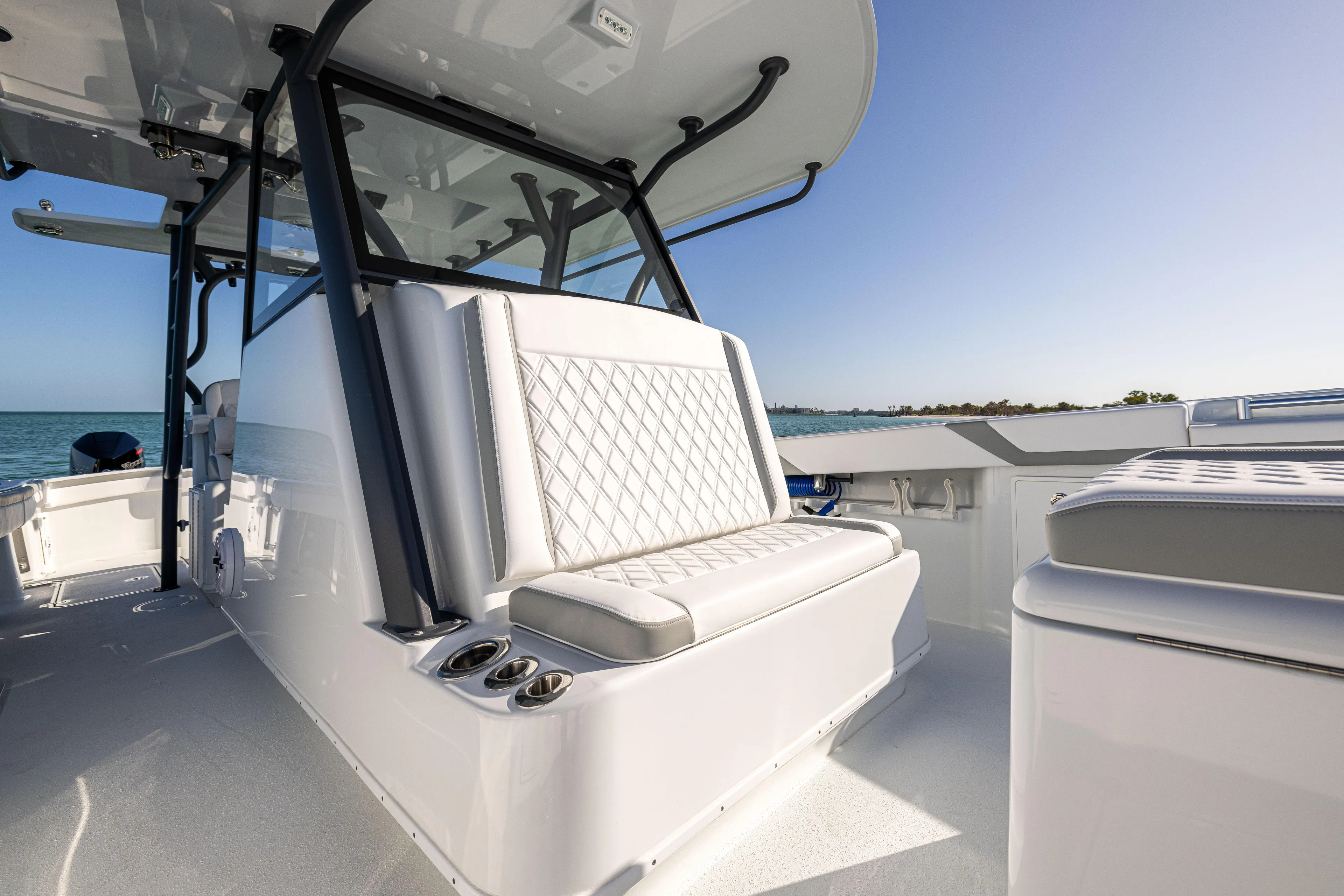  Yacht Photos Pics 2023 Yellowfin 39 Offshore boat interior with cushioned seating and ocean view.