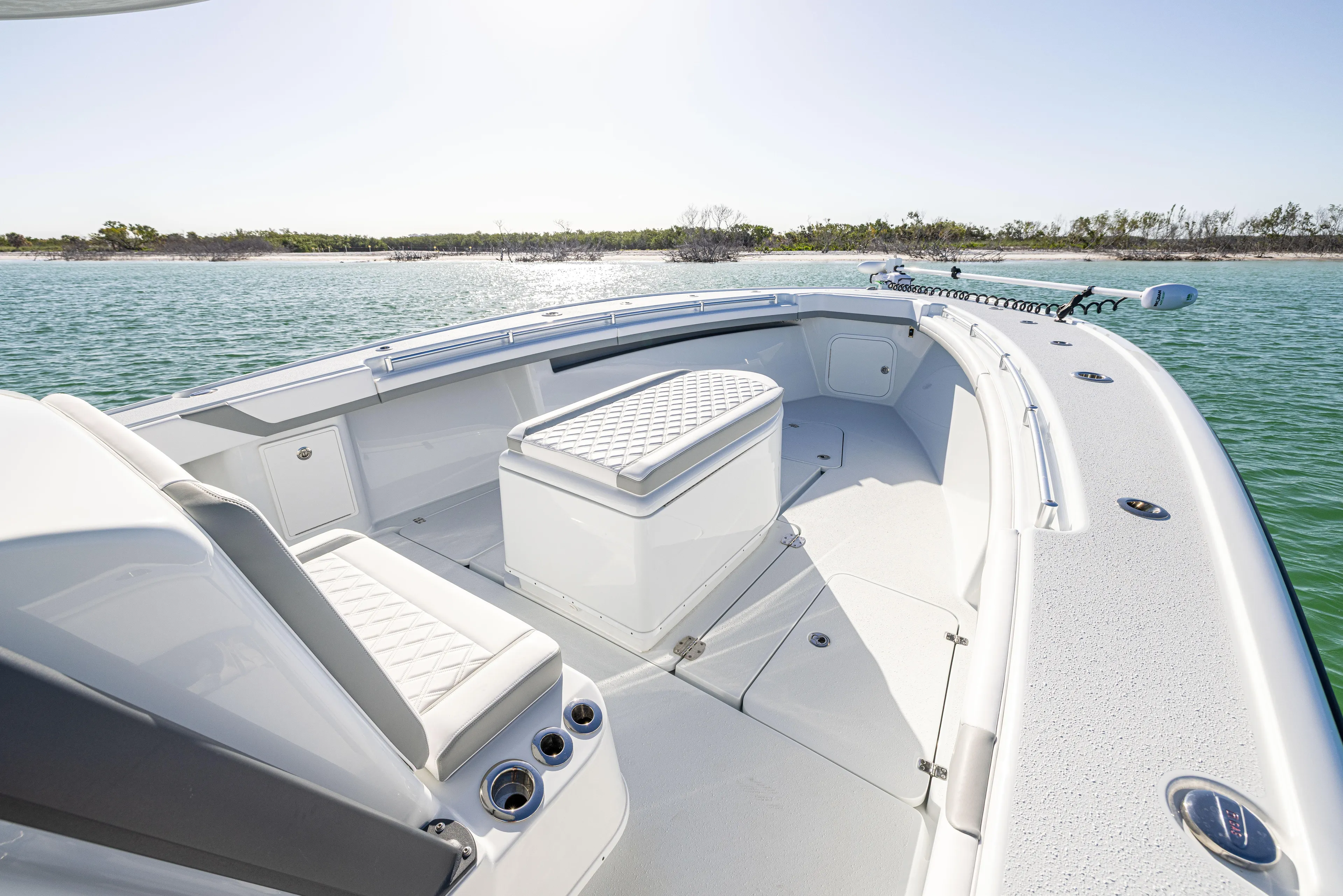  Yacht Photos Pics 2023 Yellowfin 39 Offshore boat interior with seating, on calm water.
