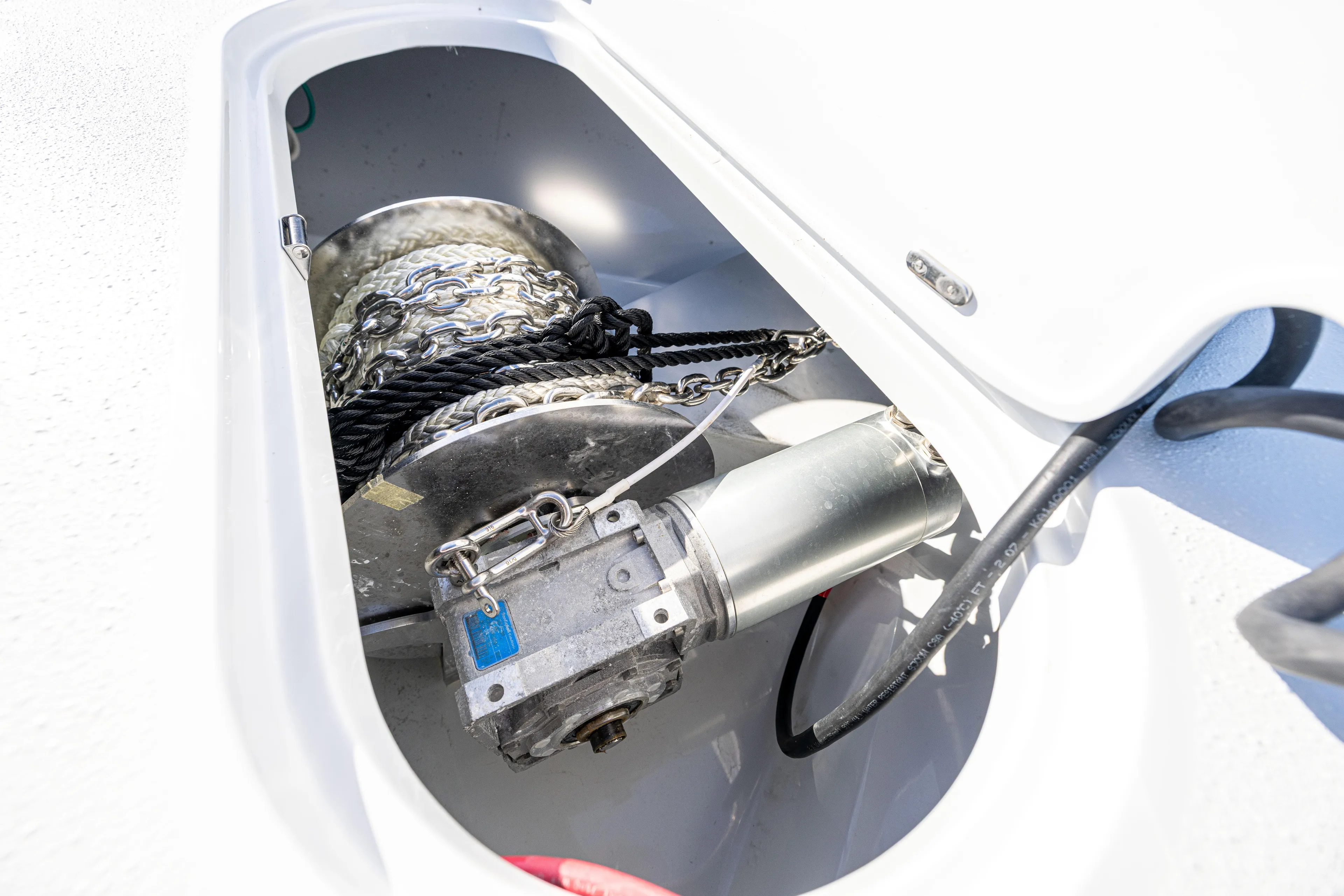  Yacht Photos Pics Anchor winch system on 2023 Yellowfin 39 Offshore boat, featuring chain and rope storage.