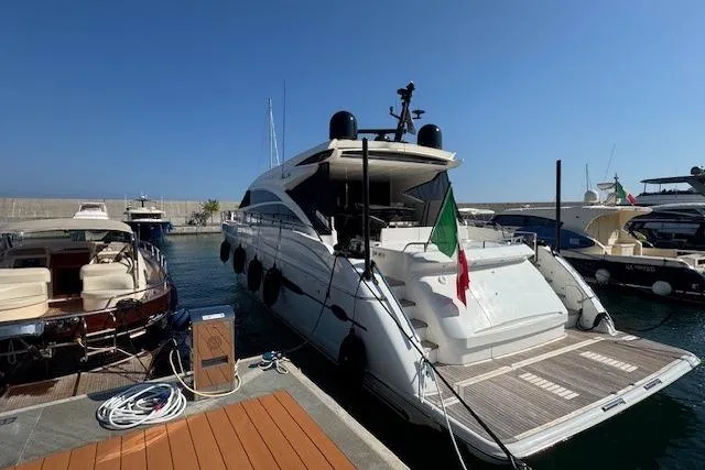  Yacht Photos Pics 2014 Princess V 72 yacht docked at marina with Italian flag.
