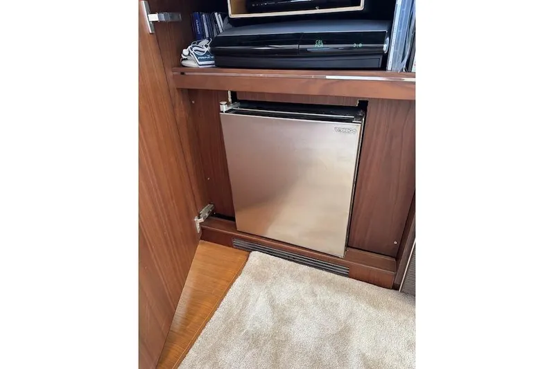  Yacht Photos Pics Compact fridge in a 2014 Princess V 72 yacht's wooden interior.