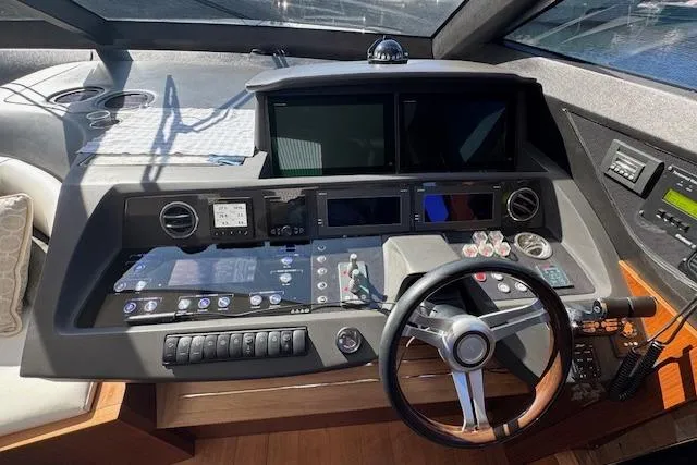  Yacht Photos Pics Control panel of a 2014 Princess V 72 yacht with modern navigation equipment.