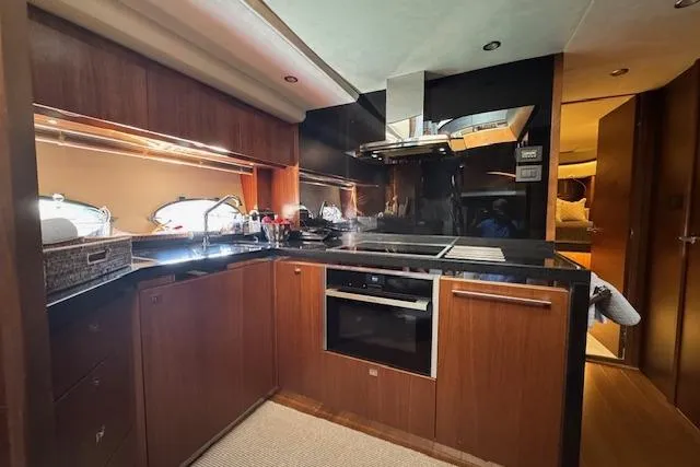  Yacht Photos Pics Luxurious kitchen interior of 2014 Princess V 72 yacht with modern appliances.