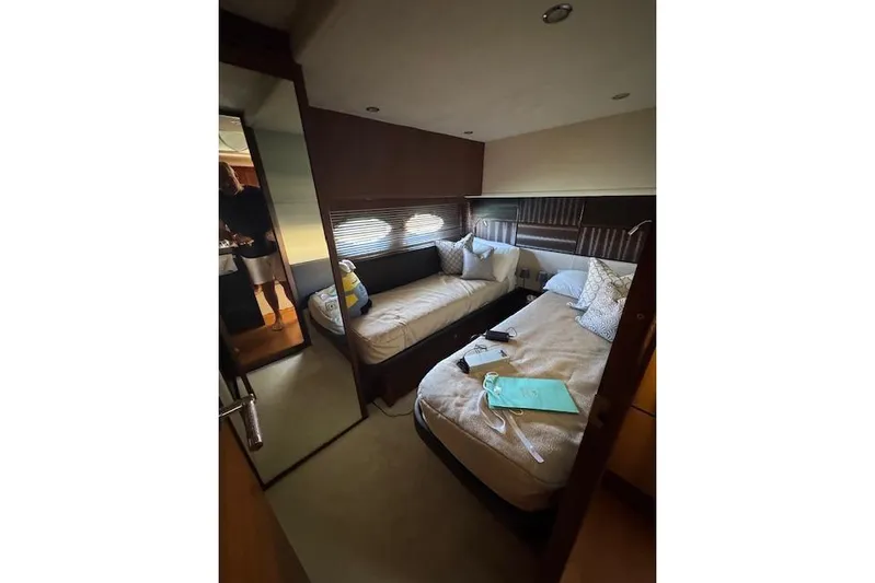  Yacht Photos Pics Luxurious cabin interior of 2014 Princess V 72 yacht with twin beds and elegant decor.