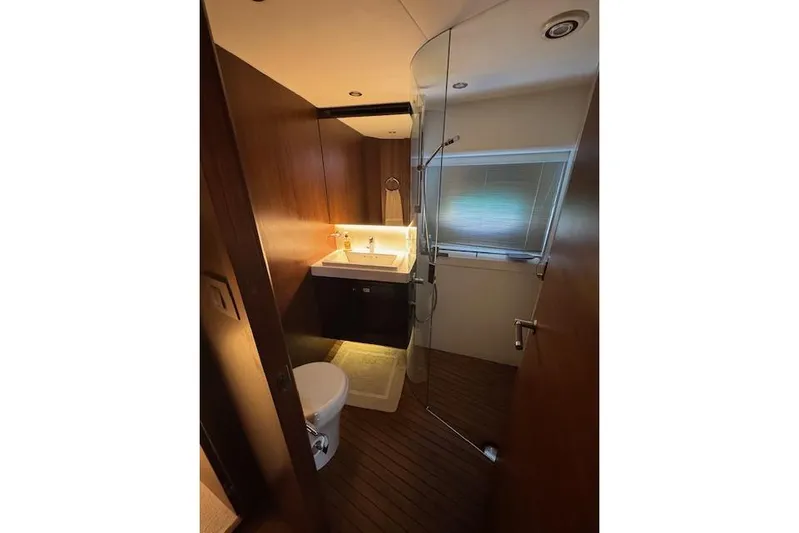  Yacht Photos Pics Luxurious bathroom interior of 2014 Princess V 72 yacht with modern fixtures.