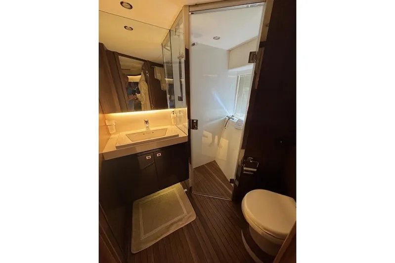  Yacht Photos Pics Luxurious bathroom in 2014 Princess V 72 yacht with modern fixtures and elegant design.