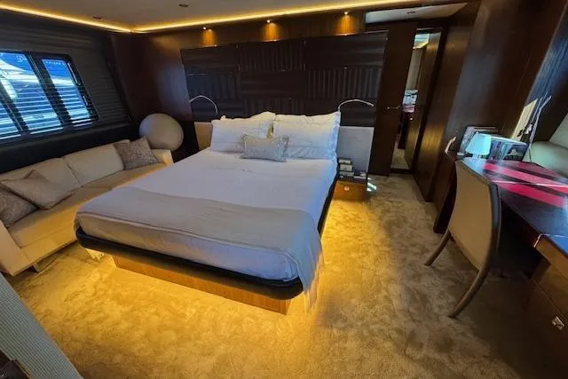  Yacht Photos Pics Luxurious bedroom interior of 2014 Princess V 72 yacht with elegant furnishings.