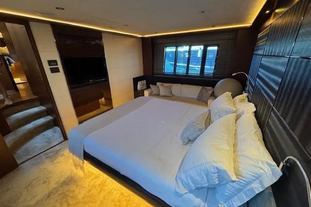  Yacht Photos Pics Luxurious bedroom interior of 2014 Princess V 72 yacht with modern design and ambient lighting.