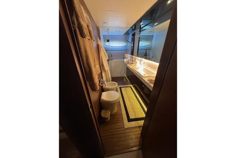 Yacht Photos Pics Luxurious bathroom interior of 2014 Princess V 72 yacht, featuring elegant fixtures and ambient lighting.