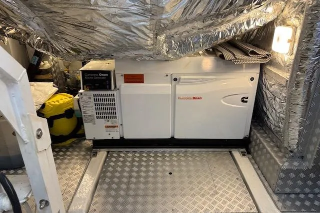  Yacht Photos Pics Cummins Onan generator in 2014 Princess V 72 yacht engine room, with metallic insulation.
