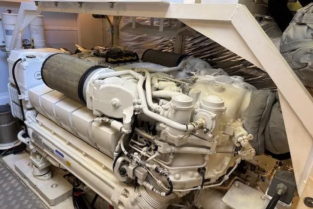  Yacht Photos Pics Engine room of a 2014 Princess V 72 yacht, showcasing a powerful marine engine.