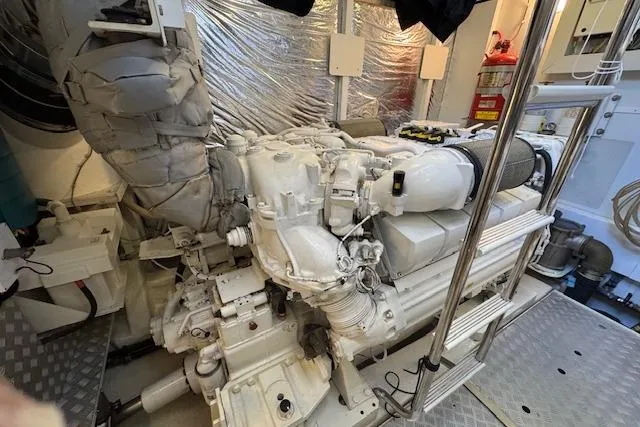  Yacht Photos Pics Engine room of a 2014 Princess V 72 yacht, showcasing a powerful marine engine.
