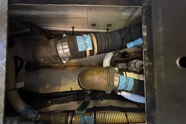  Yacht Photos Pics Engine compartment of a 2014 Princess V 72 yacht, showing hoses and fittings.