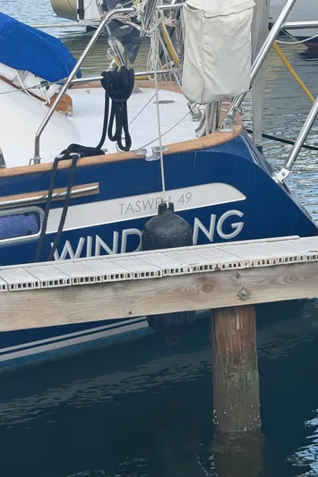 Windsong Yacht Photos Pics Sailboat "Taswell 49" docked, featuring blue hull and wooden trim, year 1989.