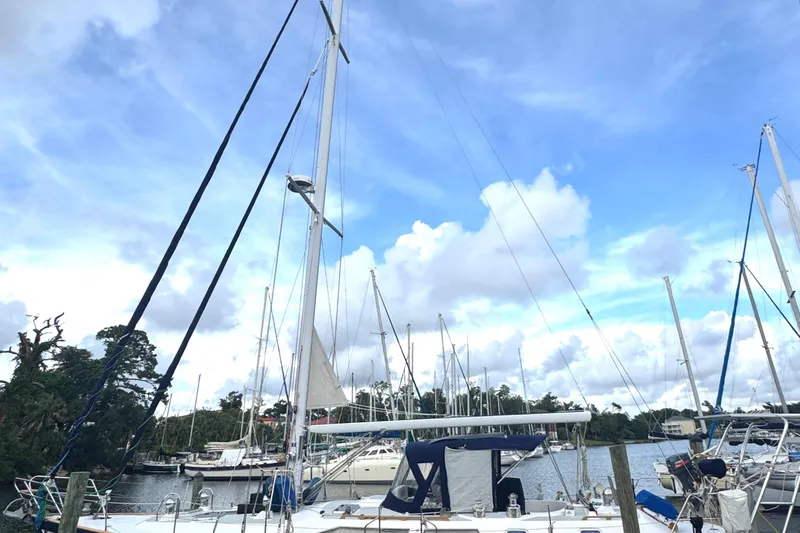 Windsong Yacht Photos Pics Sailboats docked at a marina under a blue sky, featuring a 1989 Taswell 49.