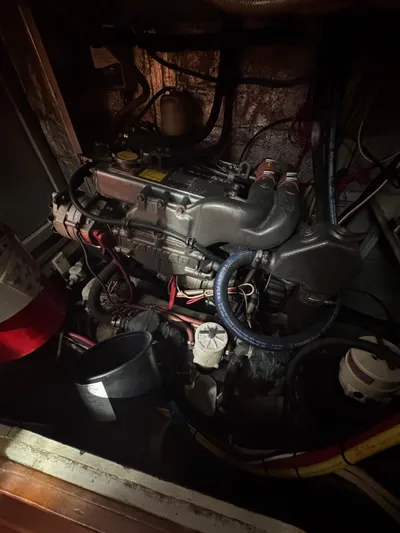 Windsong Yacht Photos Pics Engine compartment of a 1989 Taswell 49 sailboat, featuring various hoses and components.