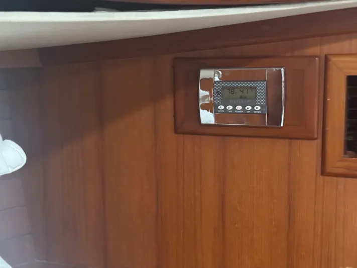 Windsong Yacht Photos Pics Wooden interior of 1989 Taswell 49 yacht with digital thermostat display.