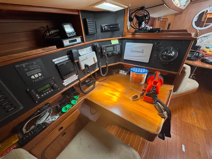 Windsong Yacht Photos Pics Navigation station on 1989 Taswell 49 yacht with Garmin equipment and various controls.