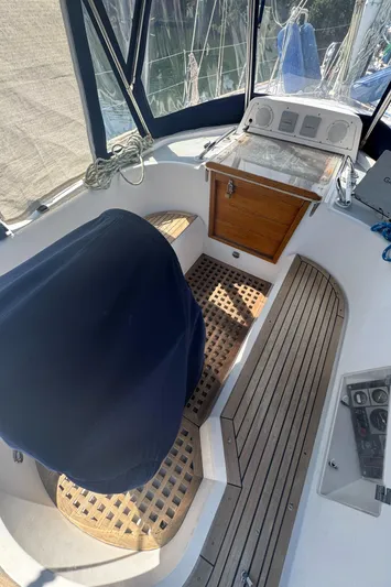 Windsong Yacht Photos Pics Cockpit of 1989 Taswell 49 sailboat with wooden flooring and covered seating.