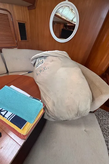 Windsong Yacht Photos Pics Cozy Taswell 49 yacht interior with cushions, mirror, and colorful towels, 1989 model.