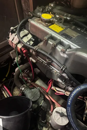 Windsong Yacht Photos Pics Engine compartment of a 1989 Taswell 49 sailboat, featuring various hoses and components.