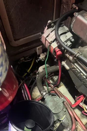 Windsong Yacht Photos Pics Engine compartment of a 1989 Taswell 49 sailboat, showing mechanical components and wiring.