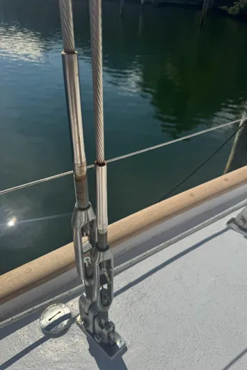 Windsong Yacht Photos Pics Close-up of rigging on a 1989 Taswell 49 sailboat, with water in the background.