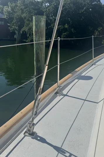 Windsong Yacht Photos Pics Deck view of 1989 Taswell 49 sailboat with railing and water in the background.