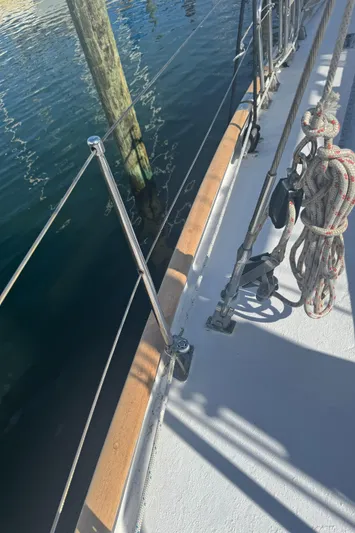 Windsong Yacht Photos Pics Deck of 1989 Taswell 49 sailboat with rigging and water reflection.