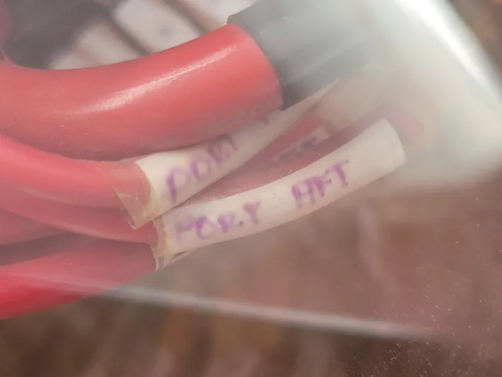 Storyteller Yacht Photos Pics Red cables labeled on a 2007 Manta 42 Mk IV sailing catamaran.